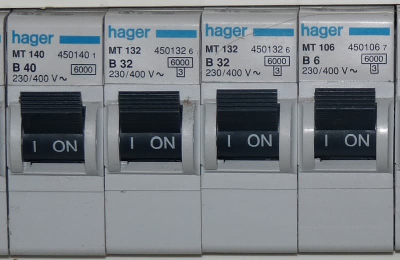 Close-up of labelled circuit breakers in a domestic switchboard
