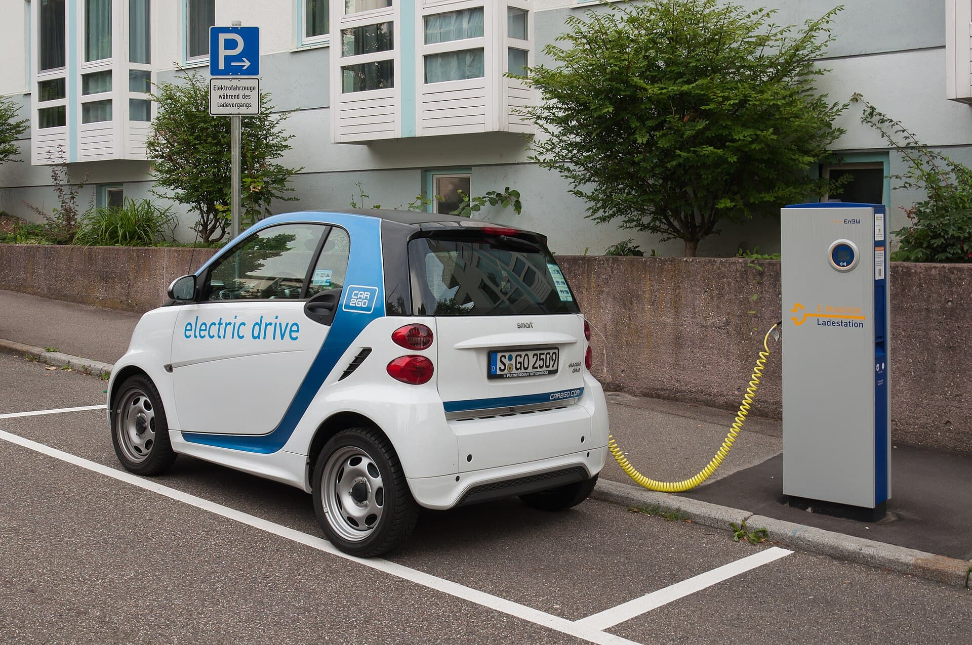 An electric vehicle at a dedicated charging station