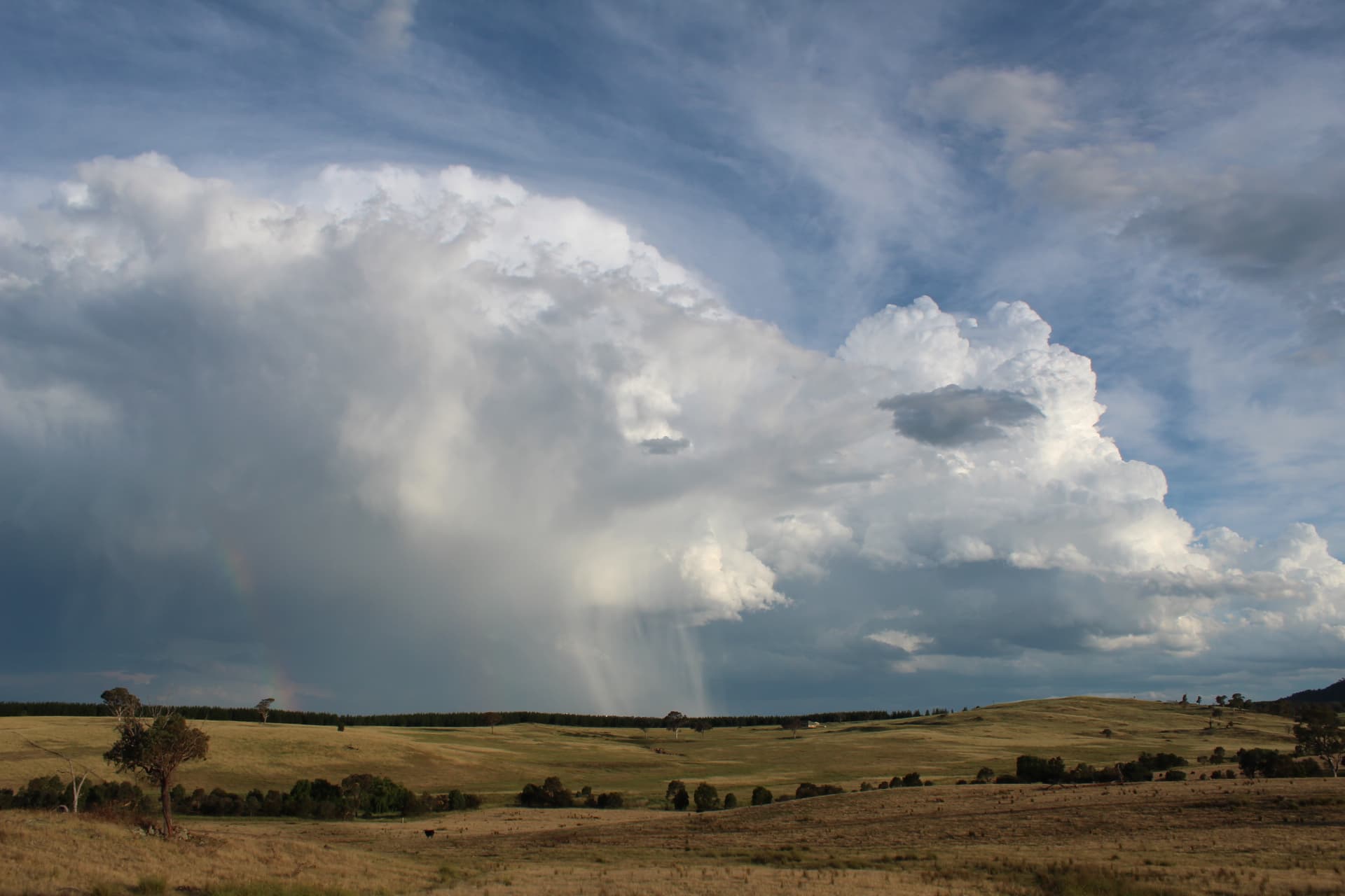 Dark storm clouds rolling over the Australian landscape